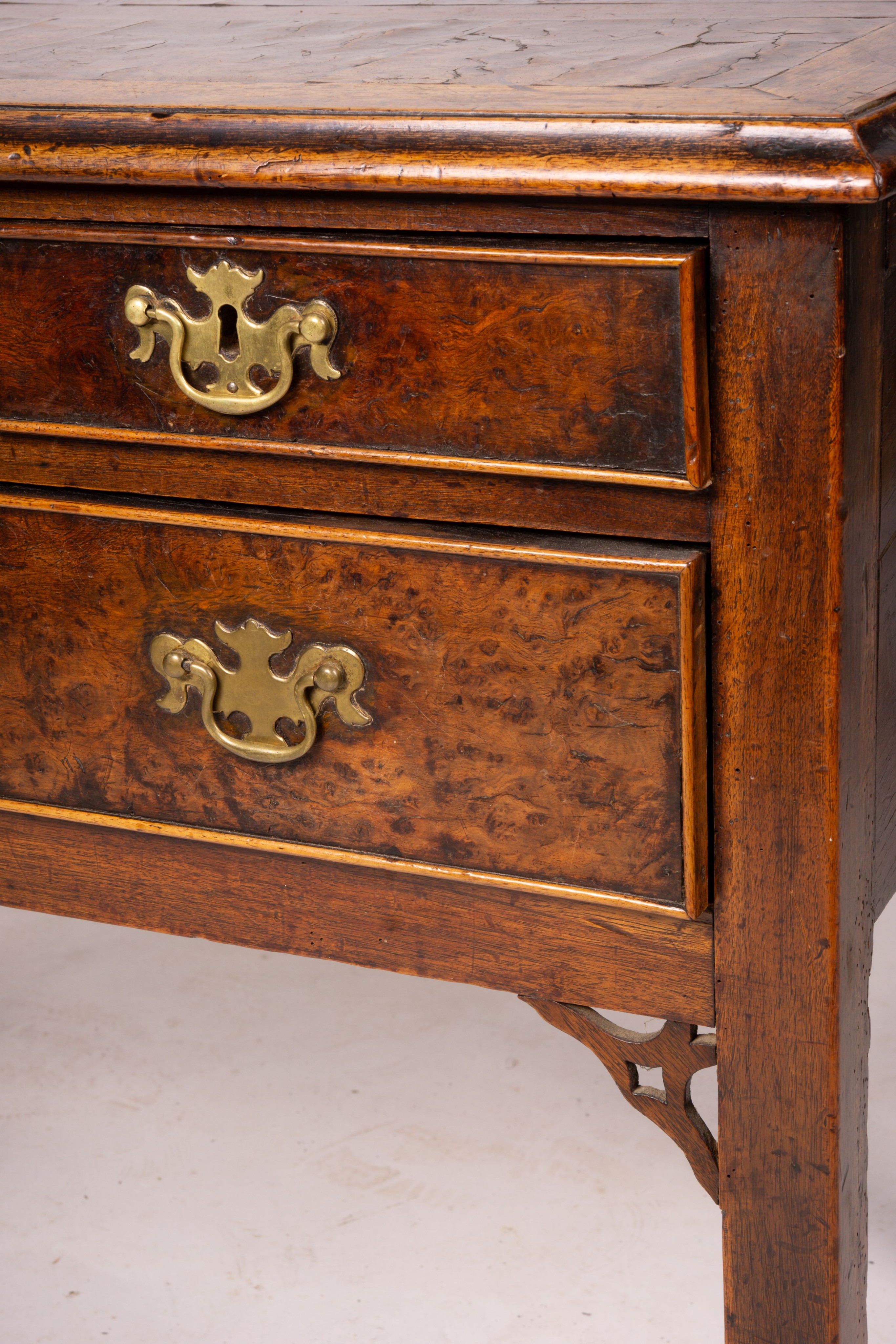 A George III oak and pollard oak three drawer side table, width 83cm, depth 51cm, height 72cm